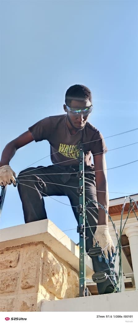 Electric fence plus razor wire. Perimeter wall install.