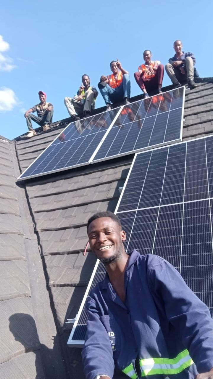 Rooftop panel installation. Full team on site.